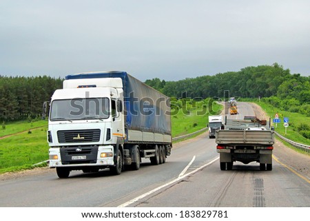 TATARSTAN, RUSSIA - MAY 29, 2013: White MAZ 5440 semi-trailer truck at the interurban road.