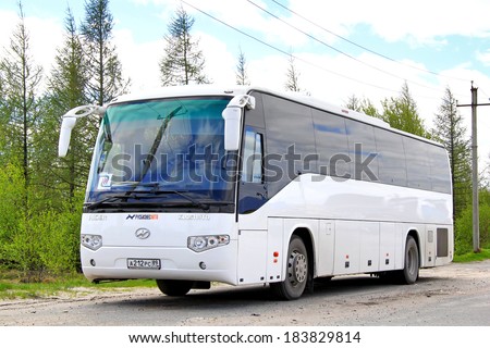 NOVYY URENGOY, RUSSIA - JUNE 22, 2013: White Higer KLQ6119TQ interurban coach at the city street.