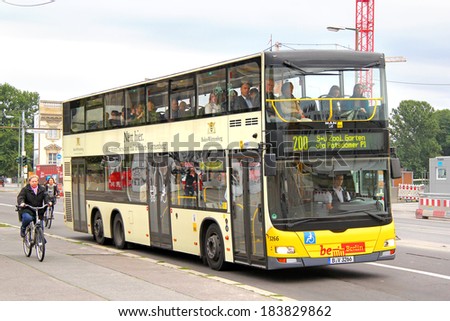 BERLIN, GERMANY - SEPTEMBER 10, 2013: Yellow MAN A39 Lion\'s City DD double-decker bus of Berliner Verkehrsbetriebe bus company at the city street.