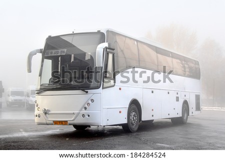 UFA, RUSSIA - OCTOBER 23, 2013: White VDL NEFAZ 52999 interurban coach at the bus station during a heavy fog.