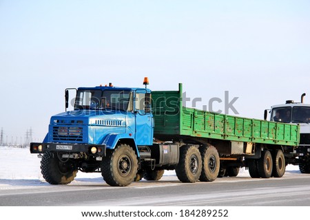 NOVYY URENGOY, RUSSIA - FEBRUARY 9, 2013: Blue KRAZ 6446 semi-trailer truck at the city street.