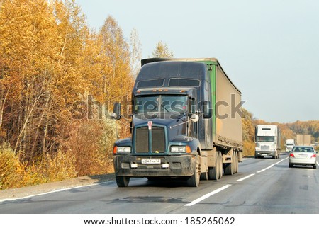CHELYABINSK REGION, RUSSIA - OCTOBER 4, 2008: Green Kenworth T600 semi-trailer truck at the interurban road.