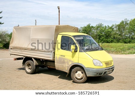 CHELYABINSK REGION, RUSSIA - JUNE 12, 2009: Yellow GAZ Gazelle cargo van at the interurban road.