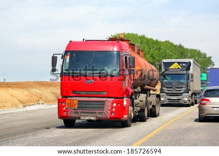 TATARSTAN, RUSSIA - MAY 29, 2013: Red Ford Cargo semi-trailer truck at the interurban road.