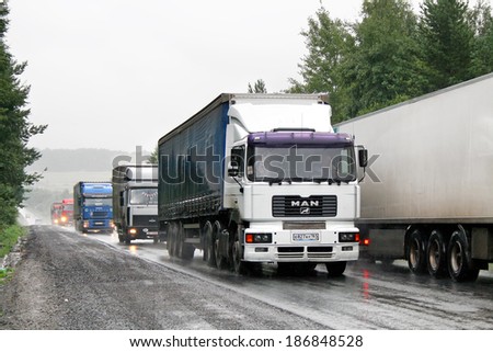 CHELYABINSK REGION, RUSSIA - AUGUST 8, 2008: White MAN F2000 semi-trailer truck at the interurban road.