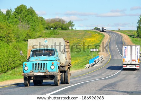 CHUVASH REPUBLIC, RUSSIA - MAY 21, 2013: Blue GAZ 53 dump truck at the interurban road.