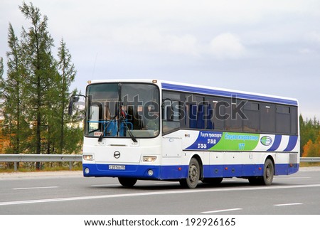 NOVYY URENGOY, RUSSIA - AUGUST 31, 2012: White and blue GOLAZ-LIAZ 5256 interurban coach at the city street.