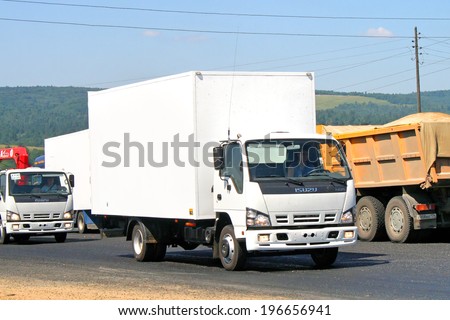 CHELYABINSK REGION, RUSSIA - JULY 19, 2008: White Isuzu NQR cargo truck at the interurban road.