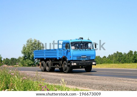 CHELYABINSK REGION, RUSSIA - JULY 19, 2008: Blue KAMAZ 53215 flatbed truck at the interurban road.