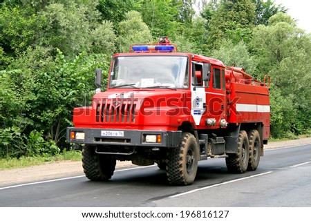 CHELYABINSK REGION, RUSSIA - JULY 13, 2008: Red Ural 4320 firetruck at the interurban road.