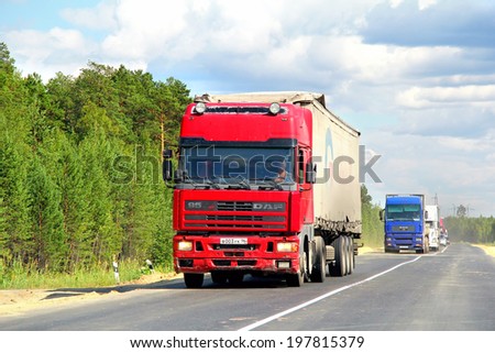 YAMAL, RUSSIA - AUGUST 4, 2012: Cherry DAF 95 semi-trailer truck at the interurban road.