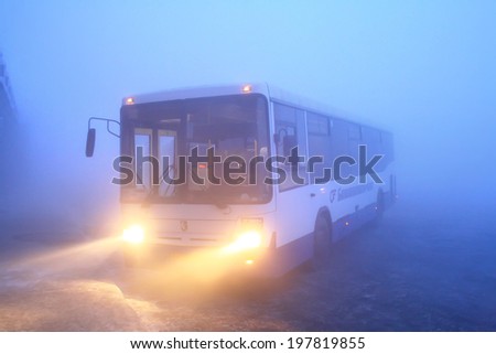 UFA, RUSSIA - JANUARY 28, 2010: White NEFAZ 5299 suburban bus at the bus station during a heavy fog.