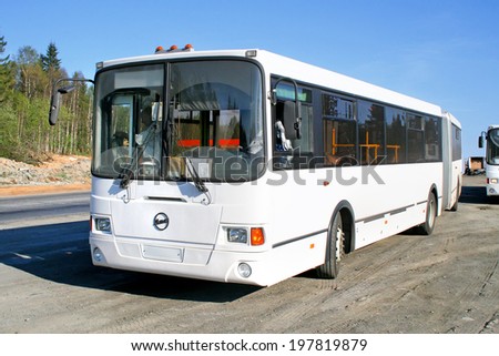 CHELYABINSK REGION, RUSSIA - MAY 24, 2008: White LIAZ 6212 articulated city bus at the interurban road.