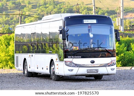 ASHA, RUSSIA - JUNE 2, 2014: White Yutong ZK6121HQ suburban bus at the city street.