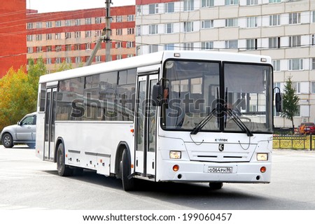 NOVYY URENGOY, RUSSIA - AUGUST 31, 2012: White NEFAZ 5299 suburban bus at the city street.
