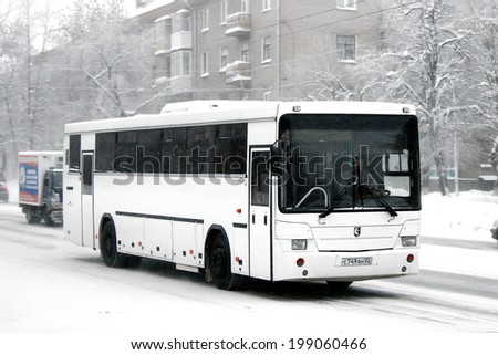 UFA, RUSSIA - JANUARY 12, 2010: White NEFAZ 5299 interurban coach at the city street.