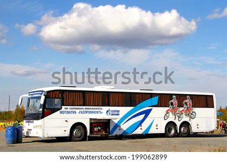 NOVYY URENGOY, RUSSIA - AUGUST 30, 2012: White Volzhanin 6216 motocross racing team\'s club coach at the city street.