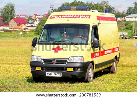 IGLINO, RUSSIA - JUNE 12, 2014: Fiat Ducato ambulance car at the country field.