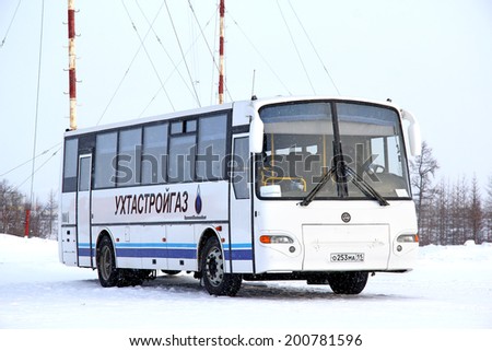 NOVYY URENGOY, RUSSIA - FEBRUARY 16, 2013: White KAVZ 4238 Avrora interurban coach at the city street.