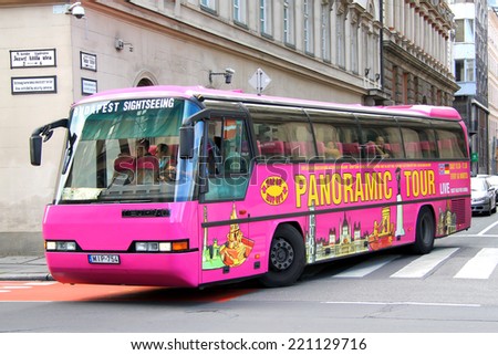 BUDAPEST, HUNGARY - JULY 23, 2014: Pink city sightseeing bus Neoplan N216 Jetliner at the city street.