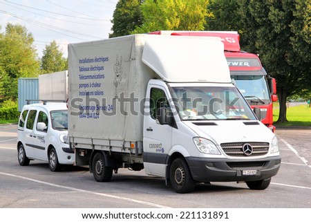 SWITZERLAND - AUGUST 5, 2014: White cargo truck Mercedes-Benz Sprinter at the interurban road.