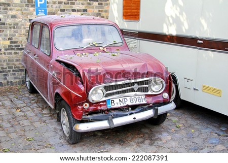 BERLIN, GERMANY - AUGUST 12, 2014: Crashed retro vehicle Renault 4 in the museum of vintage cars Classic Remise.