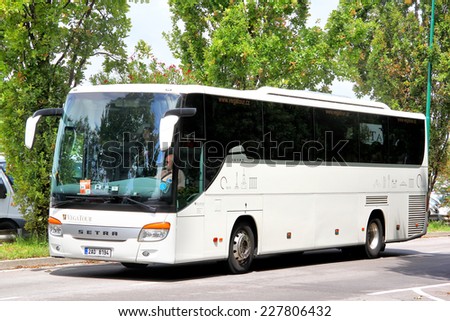 VENICE, ITALY - JULY 30, 2014: White interurban coach Setra S415GT-HD at the city street near the touristic bus station.