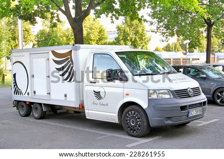 DRESDEN, GERMANY - JULY 20, 2014: White cargo van Volkswagen Transporter at the city street.