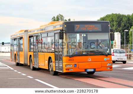 VENICE, ITALY - JULY 30, 2014: Orange articulated city bus Autodromo (MAN NG313) at the city street.