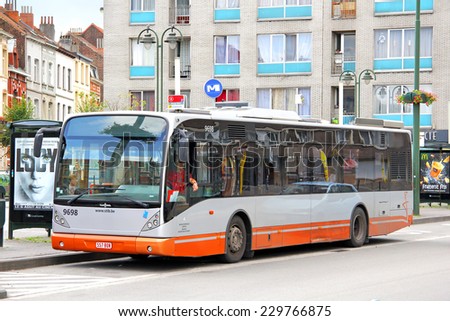 BRUSSELS, BELGIUM - AUGUST 9, 2014: City bus Van Hool A330 at the city street.