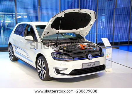 WOLFSBURG, GERMANY - AUGUST 14, 2014: Modern compact car Volkswagen Golf GTE in the trade center of the Volkswagen Autostadt.