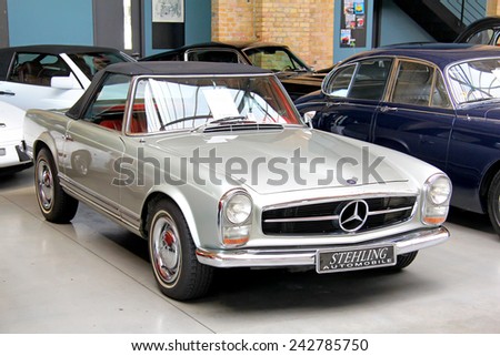 BERLIN, GERMANY - AUGUST 12, 2014: German classic vehicle Mercedes-Benz W113 230SL in the museum of vintage cars Classic Remise.