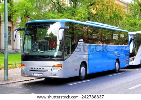BERLIN, GERMANY - AUGUST 16, 2014: Grey and blue interurban coach Setra S415GT-HD at the city street.