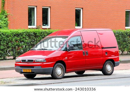 AMSTERDAM, NETHERLANDS - AUGUST 10, 2014: Small cargo van Fiat Scudo at the city street.