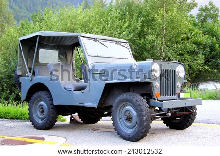 VALAIS, SWITZERLAND - AUGUST 5, 2014: American command car Willys MB in the small Apline village.