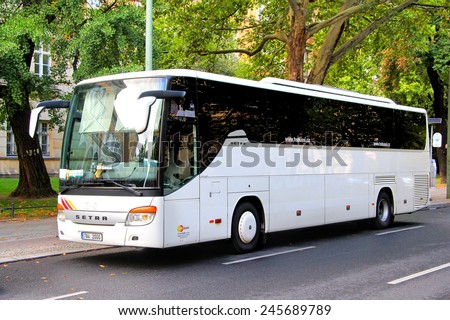 BERLIN, GERMANY - AUGUST 16, 2014: White Setra S415GT-HD interurban coach at the city street.