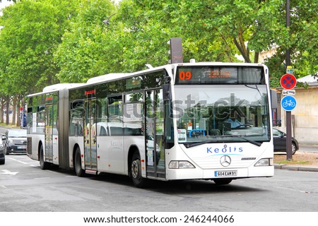 PARIS, FRANCE - AUGUST 8, 2014: White articulated city bus Mercedes-Benz O530 Citaro G at the city street.
