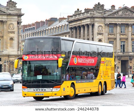 PARIS, FRANCE - AUGUST 8, 2014: Yellow city sightseeing bus Setra S431DT at the city street.