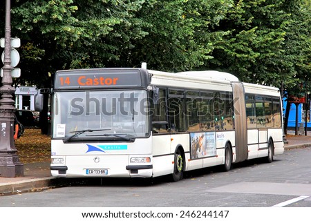 PARIS, FRANCE - AUGUST 8, 2014: White articulated city bus Renault Agora L at the city street.