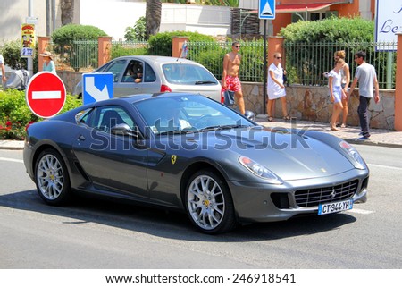SAINT-TROPEZ, FRANCE - AUGUST 3, 2014: Silver sports car Ferrari 599 GTB Fiorano at the city street.
