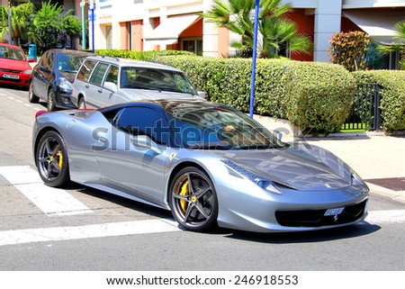 MENTON, FRANCE - AUGUST 2, 2014: Silver italian sports car Ferrari 458 Italia at the street of French Riviera.