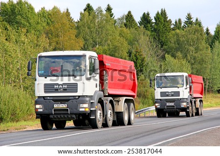 YAROSLAVL REGION, RUSSIA - AUGUST 26, 2011: White dump trucks MAN TGA at the interurban freeway.