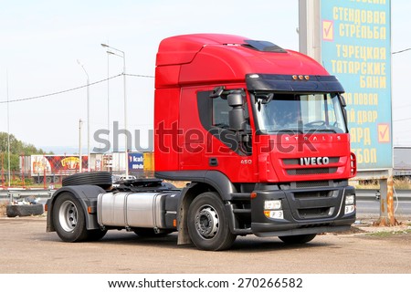 TATARSTAN, RUSSIA - AUGUST 21, 2011: Modern red semi-trailer truck Iveco Stralis AT450 at the interurban freeway.