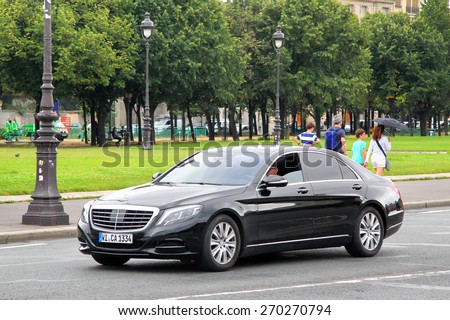 PARIS, FRANCE - AUGUST 8, 2014: Black luxury car Mercedes-Benz W222 S-class at the city street.