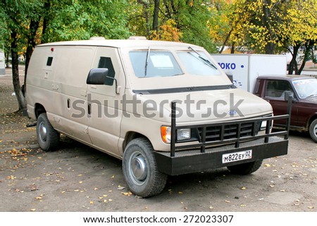 UFA, RUSSIA - OCTOBER 1, 2009: Aged american armored van Ford Econoline at the city street.