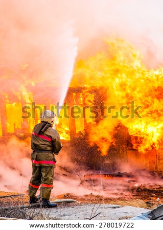 Fireman extinguishes a fire