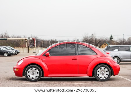 UFA, RUSSIA - APRIL 19, 2012: Red compact car Volkswagen Beetle in the used cars trade center.
