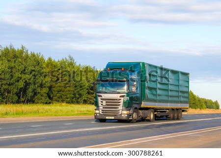 TATARSTAN, RUSSIA - JULY 19, 2014: Green truck Scania R420 at the interurban road,