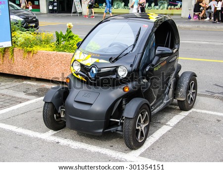 MONTREUX, SWITZERLAND - AUGUST 6, 2014: Tiny electric car Renault Twizy at the city street.
