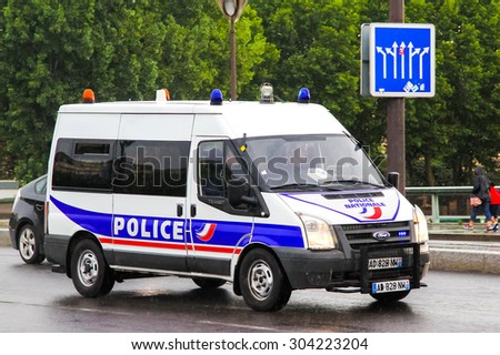 PARIS, FRANCE - AUGUST 8, 2014: Police van Ford Transit at the city street.